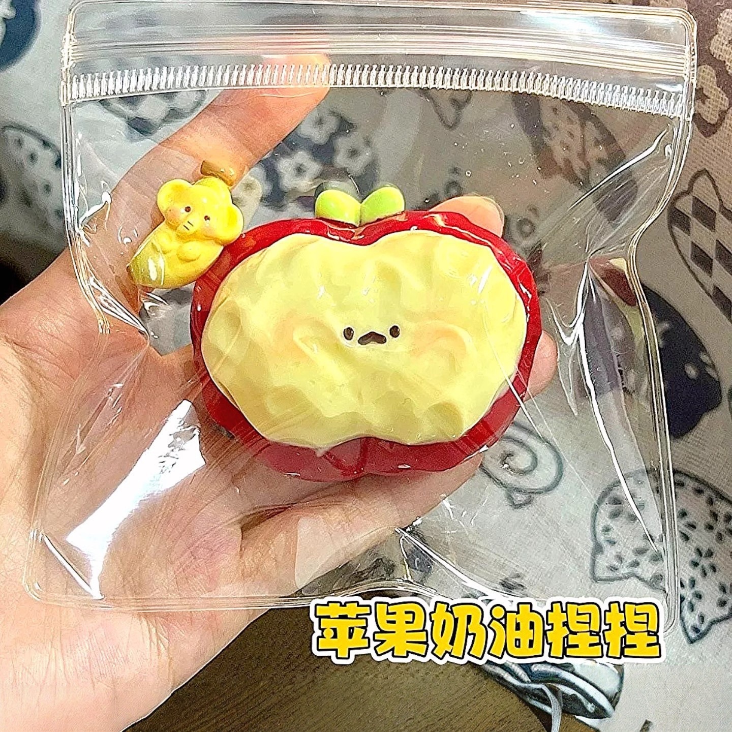 Apple-shaped squishy shown in its packaging